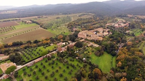 672 Aerial shot, a small ancient town situated in the middle of rural landsca Stock Footage 80800738