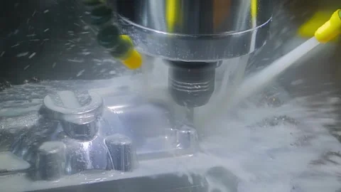 6a319f56Slow motion: Turning milling machine with cooling system2ef0ba3602b26680 Stock Footage 337063453
