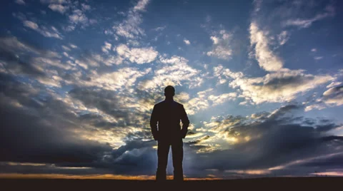 6K (!!!) &amp; 4K &amp; HD, 14-bit RAW OUTPUT, Man stands by sunset, time lapse Stock Footage 36839732