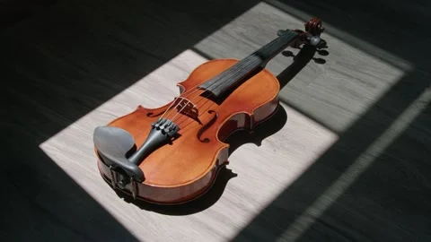 6k close up Violin on the floor with a dramatic and cinematic scene look Stock Footage 306005677