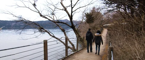 6K - Couple Walking Across a Bridge Holding Hands Stock Footage 125698690