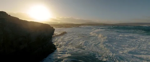 6K - Looking Up During Sunrise Over the Coast of Ireland Stock Footage 123381748
