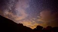 6K Milky Way and fast moving clouds above rocky canyon 4k or 4k+ Resolution