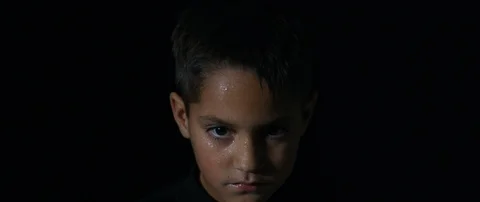 6K R3D - Young Boy Looking at Camera Close-Up Headshot 4K Video stock 100407673