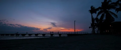 6K - Silhouette of a Beach During Sunset Stock Footage 125976030