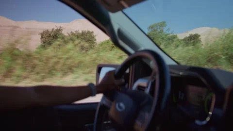 6k Slow motion driver hands holding steering weel in Moquegua countryside Stock Footage 306005679