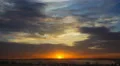 7 in 1 video! Picturesque sunset with thunderstorm clouds above village and lake 4k or 4k+ Resolution