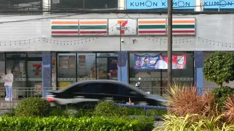7-11 store front exterior near street. Retail business concept, Bangkok Stock Footage 256068956
