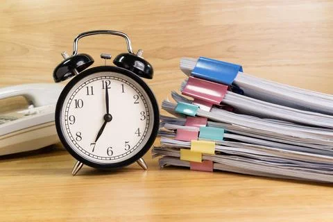 7 AM Clock on work desk in the office Time of business working concepts sel.. Stock Photos
