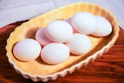 7 eggs in a baking dish Foto stock