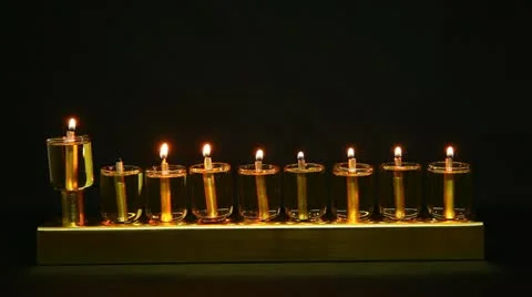 7 flames in Hanukia made of olive oil lanterns Stock Footage