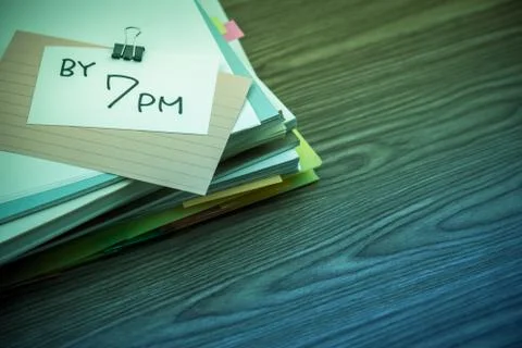 By 7 PM; The Pile of Business Documents on the Desk Stock Photos