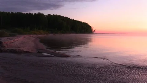 7. The stream flows into the river at sunrise Stock Footage 133434681