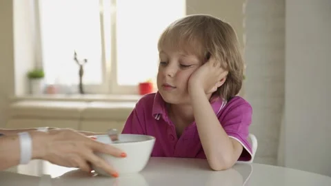 7 year old caucasian boy refuses to eat soup. Child hate soup Video stock 136665840