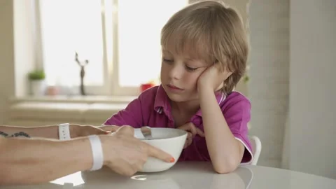 7 year old caucasian boy refuses to eat soup. Child hate soup Vidéo 136665957