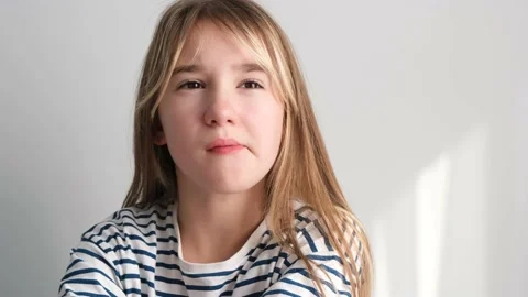 A 7-year-old girl eats a juicy ripe peach. Healthy eating with fruits, a child Stock Footage 212464459