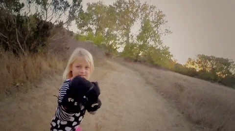 7 Year old girl shadow boxing to camera Stock Footage 33546866