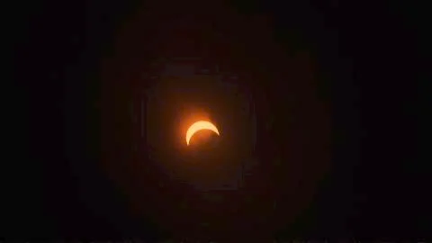 70% Partial Eclipse with Clouds. Stock Photos