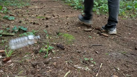 7212201 Dumping plastic bottle in the forest Stock Footage 157679829