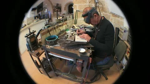 740 mature silversmith working on a piece of jewelry Stock Footage 21007727