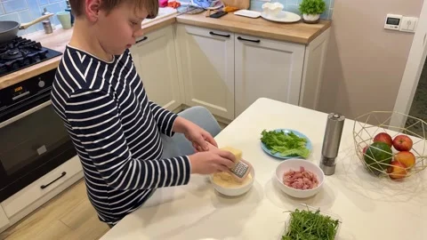 74In the kitchen, a cute guy is cooking up a delicious carbonara Stock Footage 302928410