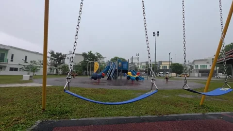 75 Empty children playground during heavy tropical monsoon rain Stock Footage 345488194