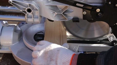 76 High-speed cutting circular saw. The man's hands are gloved. Stock Footage 160839449