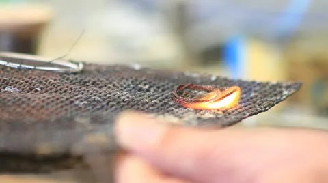 763. welding a ring shaped metal chords Stock Footage 21325478