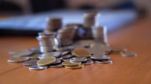 7.Stack coins zoom in  2Closeup coin stacking on table zoom-in, Money sav0200502 Stock Footage 129549287