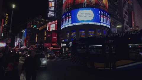 7th Ave/42nd St- Times Square- Tilt up Reveals Thomas Reuters Building at Night Stock Footage 101308573