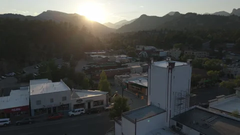 8-1-26, Estes Park, CO, USA -wider sunset flying past theater to town center Stock Footage 341239866