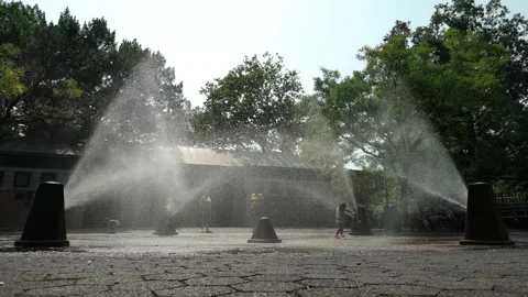 8-11-26, Brooklyn, NY, USA - slomo summer little girl runs through sprinklers Stock Footage 341898484