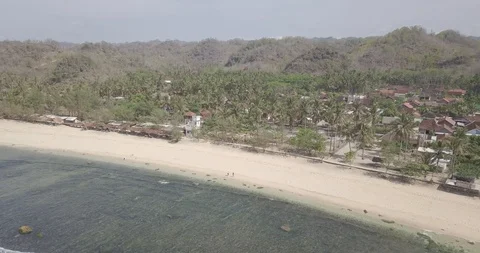 8. aerial view, bird view of two people walking on a beautiful white sand bea Stock Footage 121700570