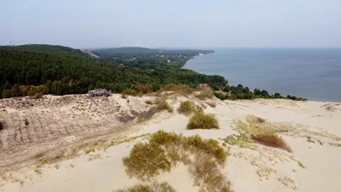 8 dunes of sand against the backdrop of the sea, sands are advancing on the Video stock 266939531