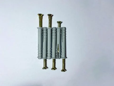 8 mm dowels with self-tapping screws on a white insulated background Stock Photos
