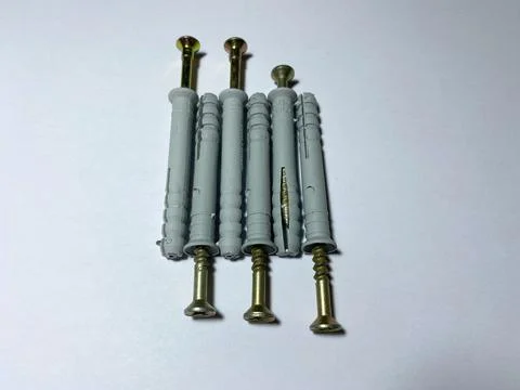 8 mm dowels with self-tapping screws on a white insulated background Stock Photos