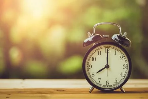 8 o'clock retro clock vintage color tone in the garden Stock Photos