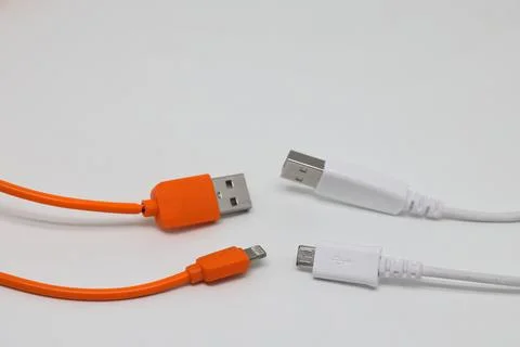8 pin USB cable on a white background, two wires orange and white. Stock Photos