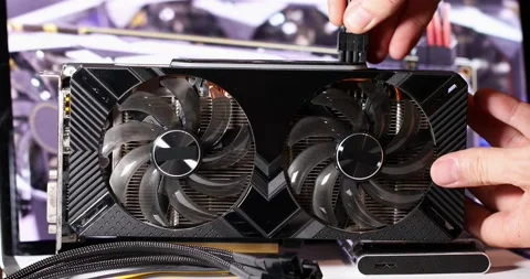 8 pin wires are inserted into the video card by hand. High quality 4k footage Stock Footage 156014439