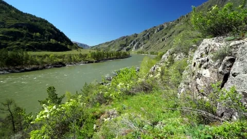 8 river in the mountains, steep and rocky shore, early spring in the mountai Stock-Footage 264104120