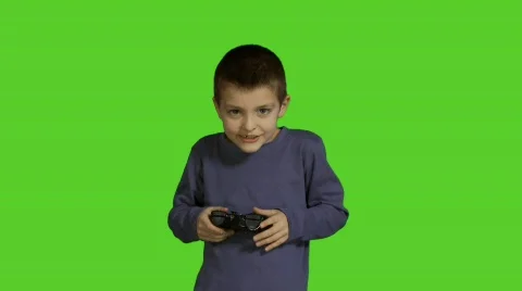 8 year old boy playing PlayStation Stock Footage 560418