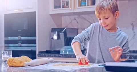 8 years old child makes hearts out of dough, close-up view. White kid  prepar Stock Footage 139328104