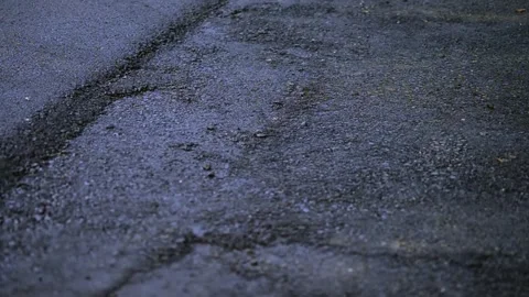 On 8/07/2023, glimpse modernization as machines lay fresh asphalt, reshapin.. Stockbeeldmateriaal 247876842