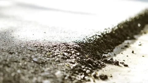 On 8/07/2023, glimpse modernization as machines lay fresh asphalt, reshapin.. Stock-Footage 247876871