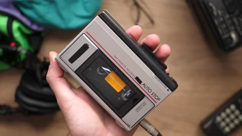 80s 90s Using a Portable Cassette Player Top View Of a Retro Desk Stock Footage 138098569