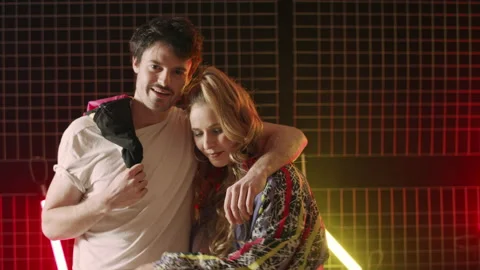 80s couple having fun in disco background Stock Footage 239623966