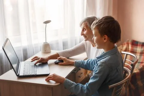 80s senior woman learning to use a laptop Stock Photos