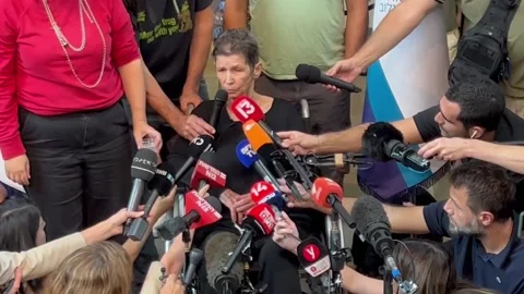 84-year-old hostage released by Hamas: I was brought into Gaza on a motorcycle a Stock Footage 253891689