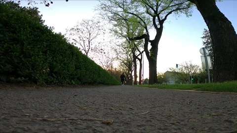 85 running along the sidewalk into Stock Footage 308326120