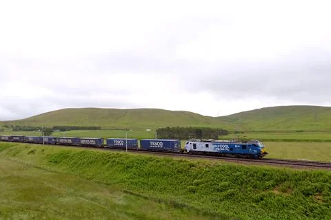 88010 heading north with a Tesco container freight train, on WCML Stock Photos